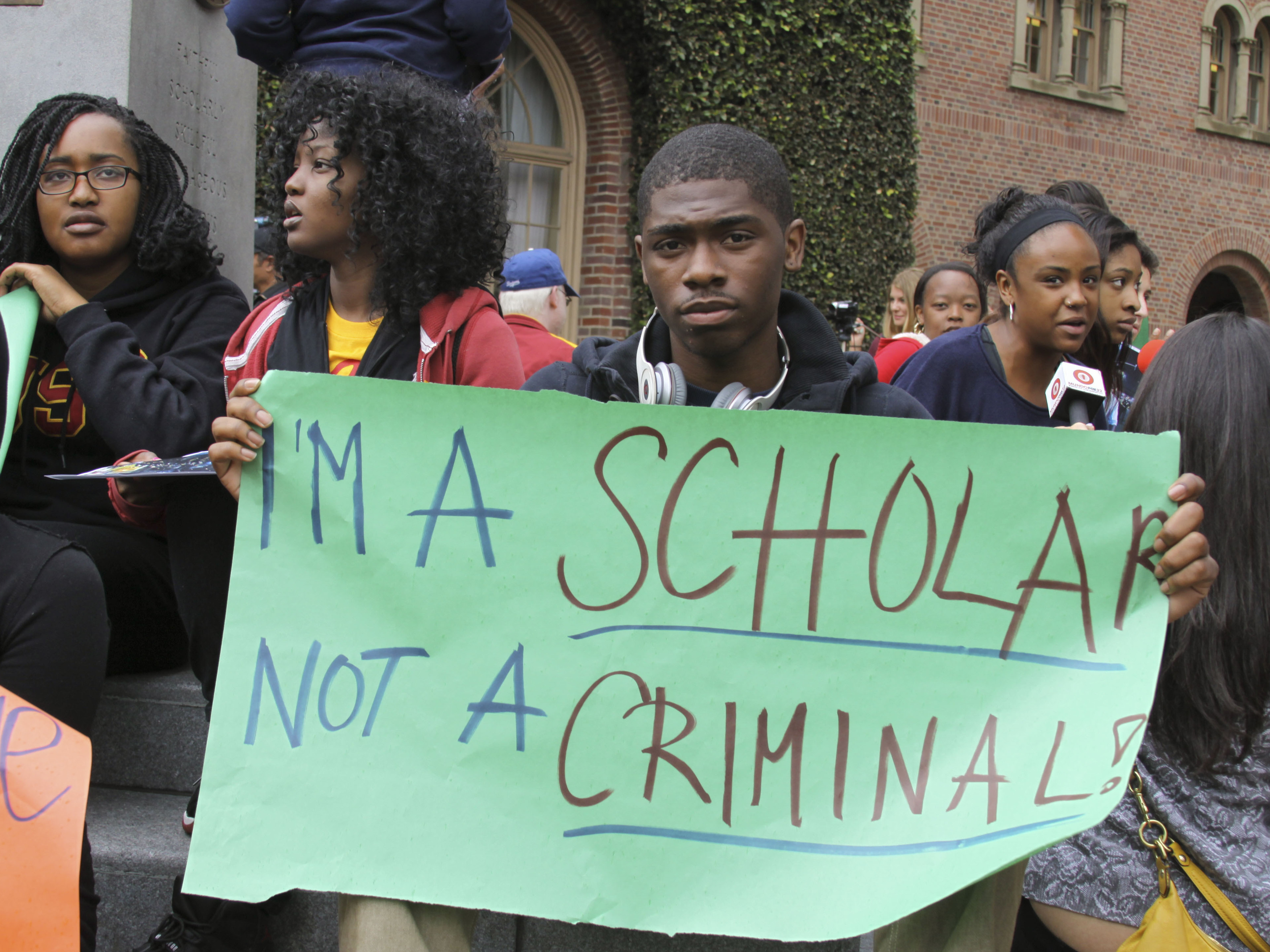 Mark Jones, a USC freshman, protests on Monday.