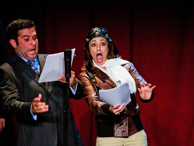 Mark Gagliardi and Autumn Reeser, as aviator Amelia Earhart, perform in The Thrilling Adventure Hour. Actors dress up and read scripts onstage in front of a live nightclub audience. Mark Gagliardi and Autumn Reeser, as aviator Amelia Earhart, perform in The Thrilling Adventure Hour. Actors dress up and read scripts onstage in front of a live nightclub audience.