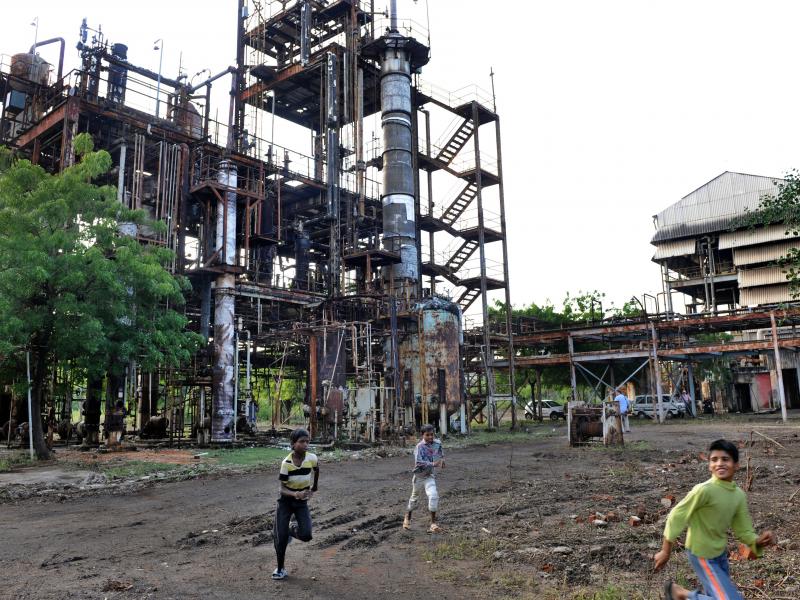 In this photograph from 2009, children play in front of the Union Carbide factory in Bhopal, India. Twenty-five years prior, in 1984, it was the site of a deadly gas leak that killed thousands of people. In this photograph from 2009, children play in front of the Union Carbide factory in Bhopal, India. Twenty-five years prior, in 1984, it was the site of a deadly gas leak that killed thousands of people.