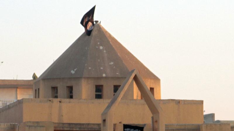 The flag of the Islamic State of Iraq and Syria, or ISIS, flutters on the dome of an Armenian Catholic Church in the northern rebel-held Syrian city of Raqqa on Sept. 28, 2013. At first, Syrian rebels and civilians welcomed the experienced Islamist fighte The flag of the Islamic State of Iraq and Syria, or ISIS, flutters on the dome of an Armenian Catholic Church in the northern rebel-held Syrian city of Raqqa on Sept. 28, 2013. At first, Syrian rebels and civilians welcomed the experienced Islamist fighte