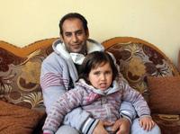 Dr. Hamad Suleiman Daher, shown here with his youngest daughter, was the first person to receive a kidney transplant in Gaza. Dr. Hamad Suleiman Daher, shown here with his youngest daughter, was the first person to receive a kidney transplant in Gaza.