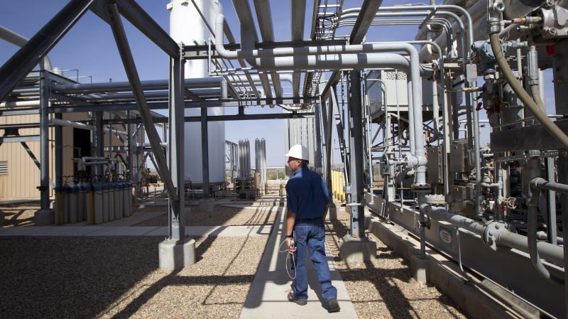 Deward Cawthon, a plant operator at the Federal Helium Reserve, walks through the Federal Crude Helium Enrichment Unit near Amarillo, Texas, in 2011. Deward Cawthon, a plant operator at the Federal Helium Reserve, walks through the Federal Crude Helium Enrichment Unit near Amarillo, Texas, in 2011.