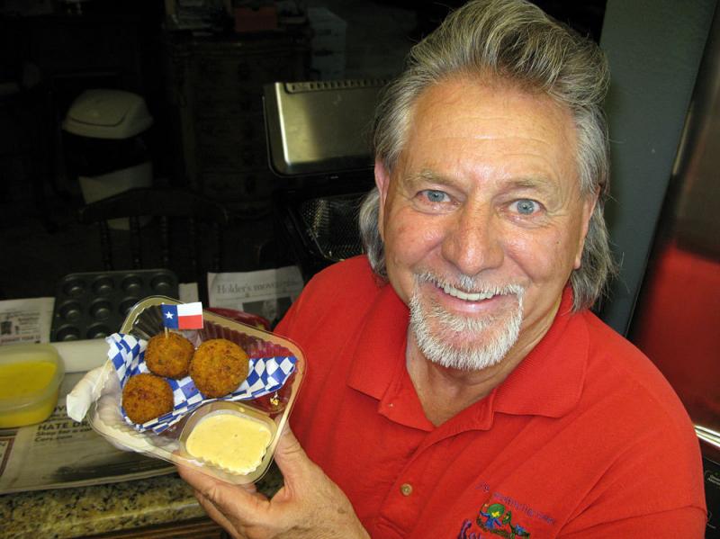 Butch Benavides — a Mexican food restaurateur turned fry-master — shows off his Texas fried fireball. Butch Benavides — a Mexican food restaurateur turned fry-master — shows off his Texas fried fireball.
