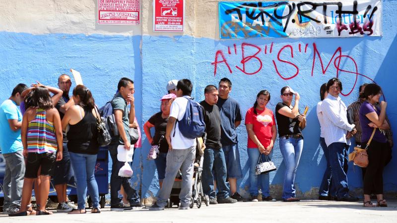 Young people wait in line to enter the Coalition for Humane Immigrant Rights of Los Angeles office on the first day of the Deferred Action for Childhood Arrivals program in August. Young people wait in line to enter the Coalition for Humane Immigrant Rights of Los Angeles office on the first day of the Deferred Action for Childhood Arrivals program in August.