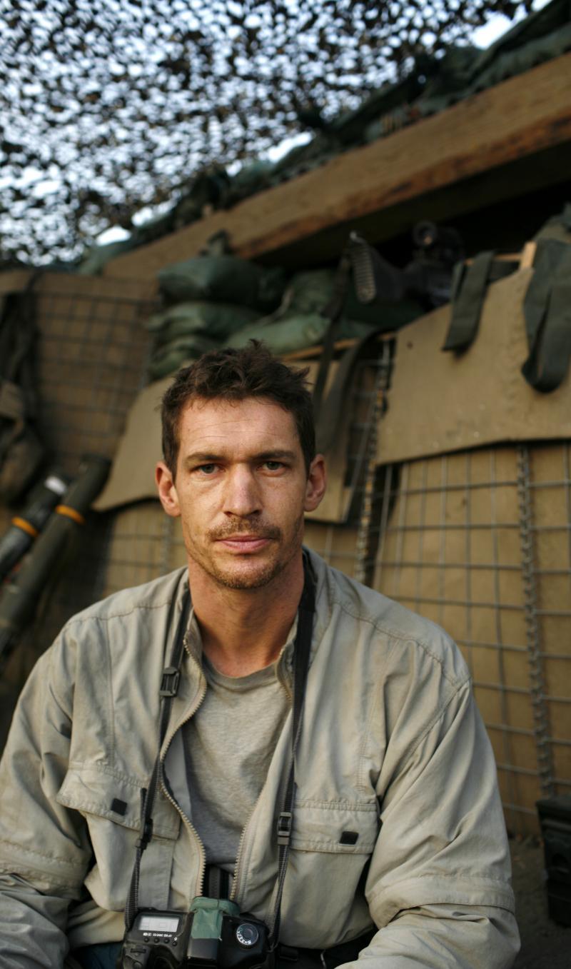 Photographer Tim Hetherington during an assignment for Vanity Fair Magazine at the Restrepo outpost. Photographer Tim Hetherington during an assignment for Vanity Fair Magazine at the Restrepo outpost.
