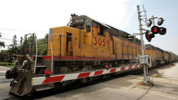 A Union Pacific freight train passes over a grade crossing in Elmhurst, Ill. A Union Pacific freight train passes over a grade crossing in Elmhurst, Ill.