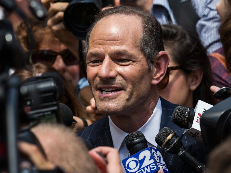 Reporters swarm around former New York Gov. Eliot Spitzer as he attempts to collect signatures for his run for New York City comptroller. Reporters swarm around former New York Gov. Eliot Spitzer as he attempts to collect signatures for his run for New York City comptroller.