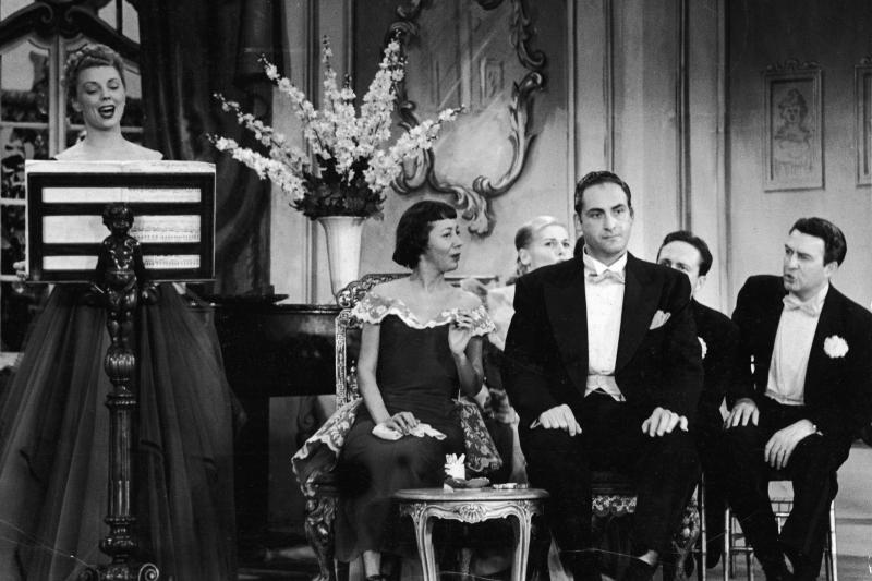 Caesar, flanked by cast performers Imogene Coca and Carl Reiner, listens to a singer in a skit from the TV comedy series Your Show of Shows, in 1952. Caesar, flanked by cast performers Imogene Coca and Carl Reiner, listens to a singer in a skit from the TV comedy series Your Show of Shows, in 1952.