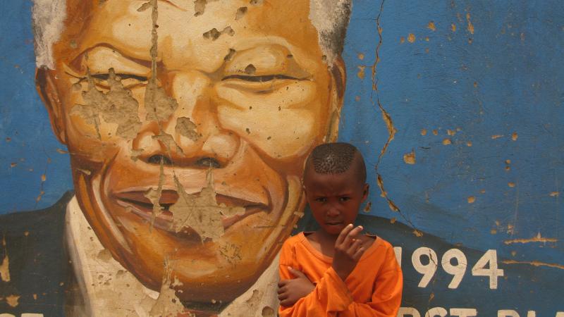 A South African boy stands in front of a mural of Nelson Mandela in Soweto, South Africa, earlier this month. A South African boy stands in front of a mural of Nelson Mandela in Soweto, South Africa, earlier this month.