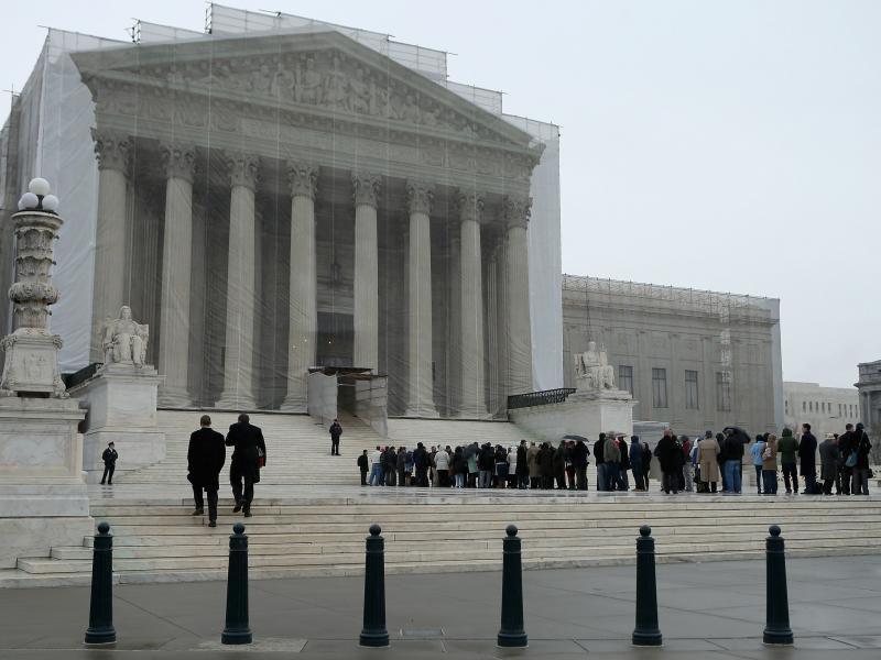 People stand in line outside the U.S. Supreme Court on Monday. People stand in line outside the U.S. Supreme Court on Monday.