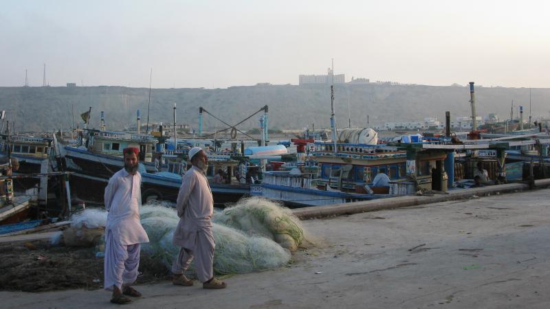 Two men stand near the port in Gwadar, Pakistan. NPR's Phil Reeves unexpectedly ended up a VIP there — and it wasn't a good feeling. Two men stand near the port in Gwadar, Pakistan. NPR's Phil Reeves unexpectedly ended up a VIP there — and it wasn't a good feeling.