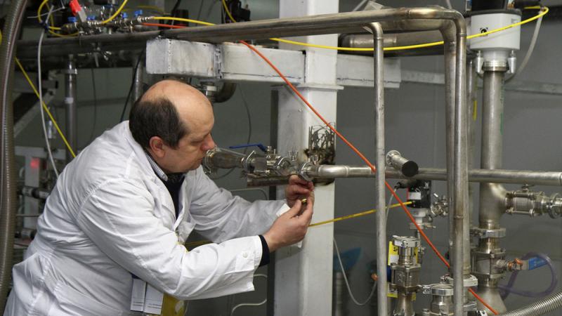 An International Atomic Energy Agency inspector cuts a uranium enrichment connection at Iran's Natanz facility, 200 miles south of Tehran, in 2014. The U.S. Congress is expected to address the Iranian nuclear deal this month. One unresolved issue: How muc An International Atomic Energy Agency inspector cuts a uranium enrichment connection at Iran's Natanz facility, 200 miles south of Tehran, in 2014. The U.S. Congress is expected to address the Iranian nuclear deal this month. One unresolved issue: How muc