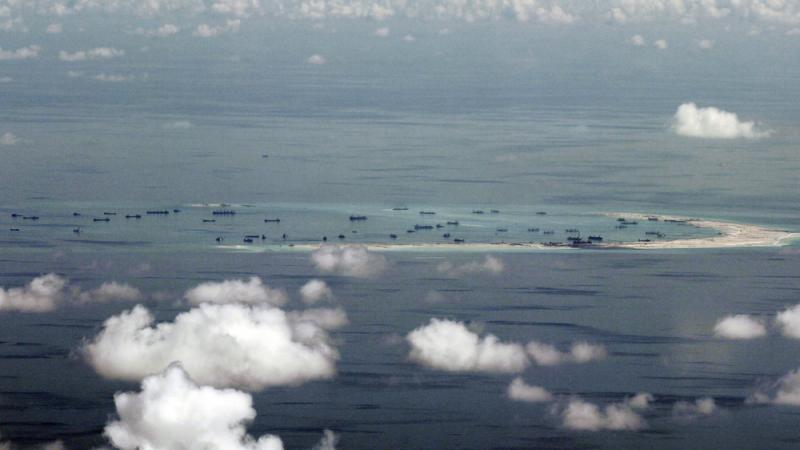 A photo taken days ago shows alleged on-going reclamation by China of Mischief Reef in the Spratly Islands in the South China Sea. A photo taken days ago shows alleged on-going reclamation by China of Mischief Reef in the Spratly Islands in the South China Sea.