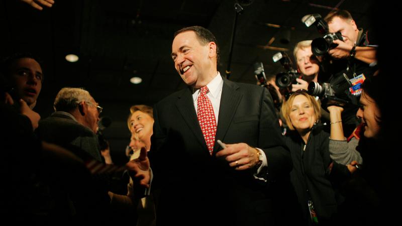 Huckabee greets supporters ahead of his victory in the 2008 Iowa caucus. Huckabee greets supporters ahead of his victory in the 2008 Iowa caucus.