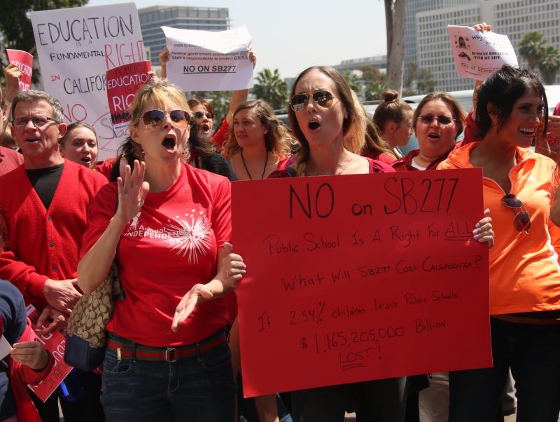 Parents and teachers who oppose efforts to end the personal belief exemption on vaccinations rally in Los Angeles on April 14. Parents and teachers who oppose efforts to end the personal belief exemption on vaccinations rally in Los Angeles on April 14.