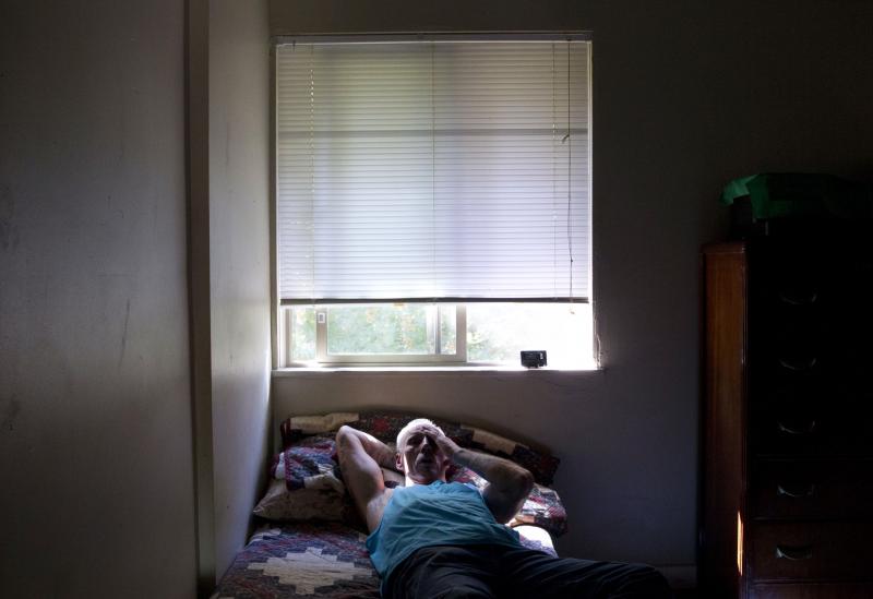 Dan Huff rests after a long day's work. He spent much of his life incarcerated in the California prison system. Now, he lives in drug- and alcohol-free transitional housing in Portland, Ore. Dan Huff rests after a long day's work. He spent much of his life incarcerated in the California prison system. Now, he lives in drug- and alcohol-free transitional housing in Portland, Ore.