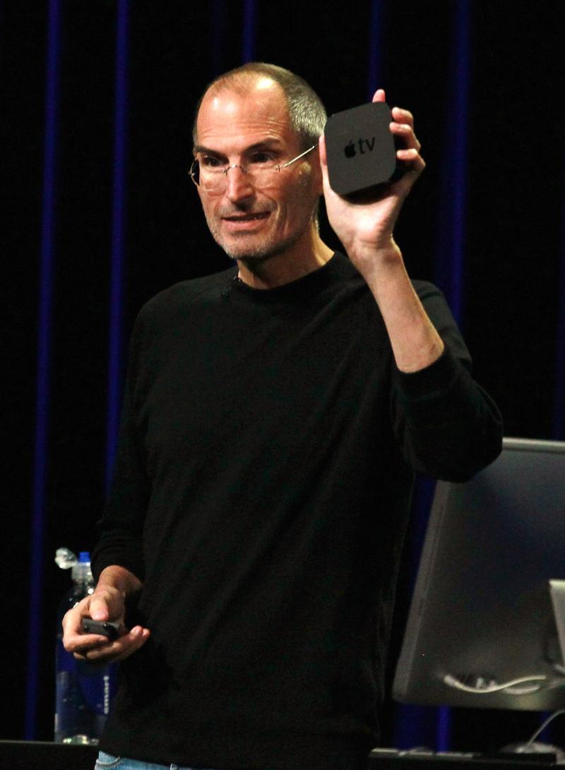 Steve Jobs shows off a second-generation Apple TV during a press event in September 2010. Steve Jobs shows off a second-generation Apple TV during a press event in September 2010.