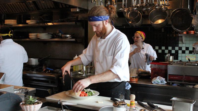 Carter Jorgensen, with head chef Zephyr Paquette in the background, at Seattle's Coastal Kitchen. Restaurants are one of the largest employers of low-wage workers in the city. Carter Jorgensen, with head chef Zephyr Paquette in the background, at Seattle's Coastal Kitchen. Restaurants are one of the largest employers of low-wage workers in the city.