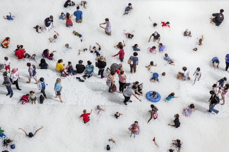 Museumgoers play in the 10,000-square-foot exhibition called "The Beach" at the National Building Museum in Washington, D.C. Museumgoers play in the 10,000-square-foot exhibition called "The Beach" at the National Building Museum in Washington, D.C.