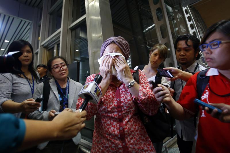 A woman at Kuala Lumpur International Airport reacts to news of crash. The flight was on its way to the Malaysian capital. A woman at Kuala Lumpur International Airport reacts to news of crash. The flight was on its way to the Malaysian capital.