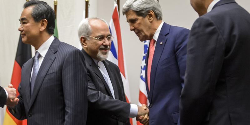 Iranian Foreign Minister Mohammad Javad Zarif shakes hands with U.S. Secretary of State John Kerry on Nov. 24 in Geneva, after the announcement of a deal halting parts of Iran's nuclear program. Iranian Foreign Minister Mohammad Javad Zarif shakes hands with U.S. Secretary of State John Kerry on Nov. 24 in Geneva, after the announcement of a deal halting parts of Iran's nuclear program.