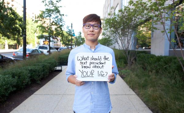 NPR's Wei Quan holds a sign prompting people to respond to the #DearWashington social media conversation about what issues the next president should know about this election season. NPR's Wei Quan holds a sign prompting people to respond to the #DearWashington social media conversation about what issues the next president should know about this election season.