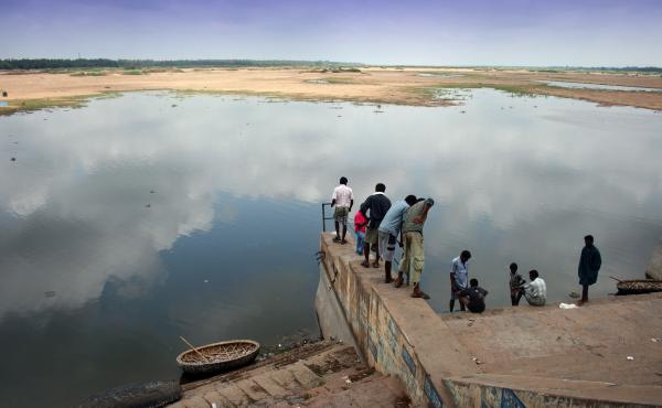 People gather at bank of the Cauvery River in the state of Tamil Nadu. People gather at bank of the Cauvery River in the state of Tamil Nadu.