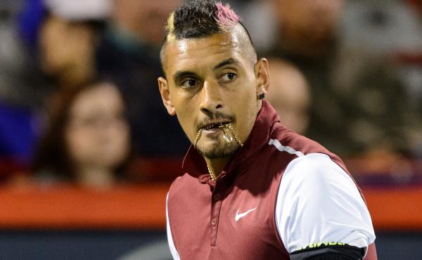 Tennis bad boy Nick Kyrgios bites his chain during his Rogers Cup match against Stan Wawrinka. Tennis bad boy Nick Kyrgios bites his chain during his Rogers Cup match against Stan Wawrinka.