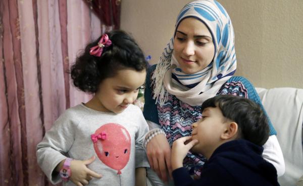 Syrian refugee Maryam al-Jaddou sits with her children Maria (left) and Hasan in their apartment in Dallas. Jaddou says she decided to leave Syria in 2012 after her family's home in Homs was bombed and there was nowhere safe left to live. Syrian refugee Maryam al-Jaddou sits with her children Maria (left) and Hasan in their apartment in Dallas. Jaddou says she decided to leave Syria in 2012 after her family's home in Homs was bombed and there was nowhere safe left to live.