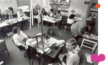 An old photo of the WFDD team in their news room.