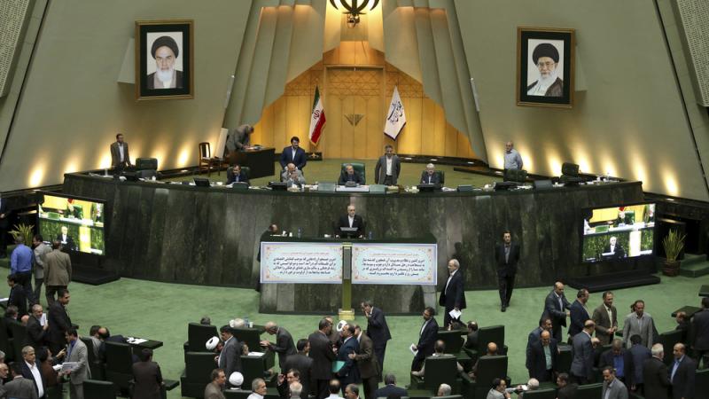 Head of Iran's Atomic Energy Organization Ali Akbar Salehi, center, speaks in an open session of parliament while discussing the bill on Iran's nuclear deal with world powers, in Tehran, Iran, Oct. 11, 2015. Starting Sunday, the approved nuclear deal begi Head of Iran's Atomic Energy Organization Ali Akbar Salehi, center, speaks in an open session of parliament while discussing the bill on Iran's nuclear deal with world powers, in Tehran, Iran, Oct. 11, 2015. Starting Sunday, the approved nuclear deal begi