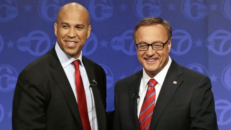 Democrat Cory Booker (left) and Republican Steve Lonegan stand together after their first debate in the race for U.S. Senate on Oct. 4 in Trenton, N.J. Democrat Cory Booker (left) and Republican Steve Lonegan stand together after their first debate in the race for U.S. Senate on Oct. 4 in Trenton, N.J.