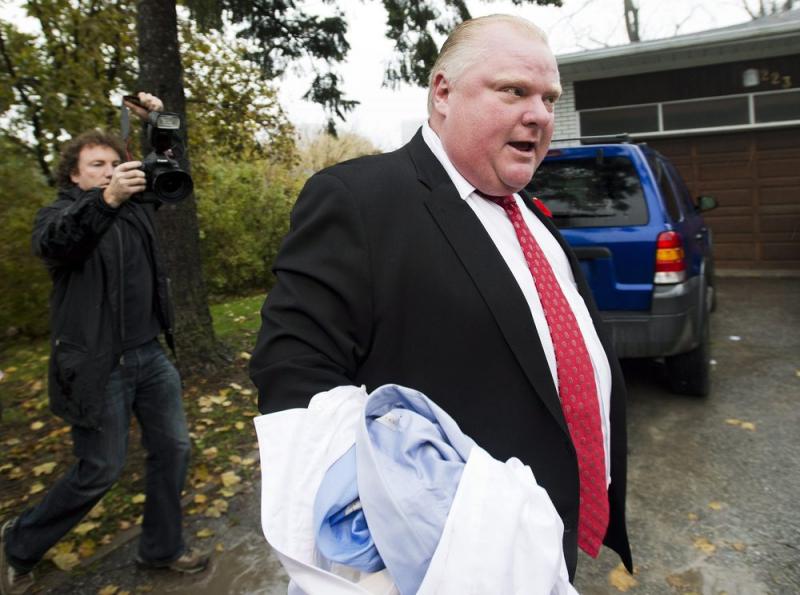 Toronto Mayor Rob Ford told members of the media to get off his property as he left his home in Toronto on Oct. 31. Toronto Mayor Rob Ford told members of the media to get off his property as he left his home in Toronto on Oct. 31.