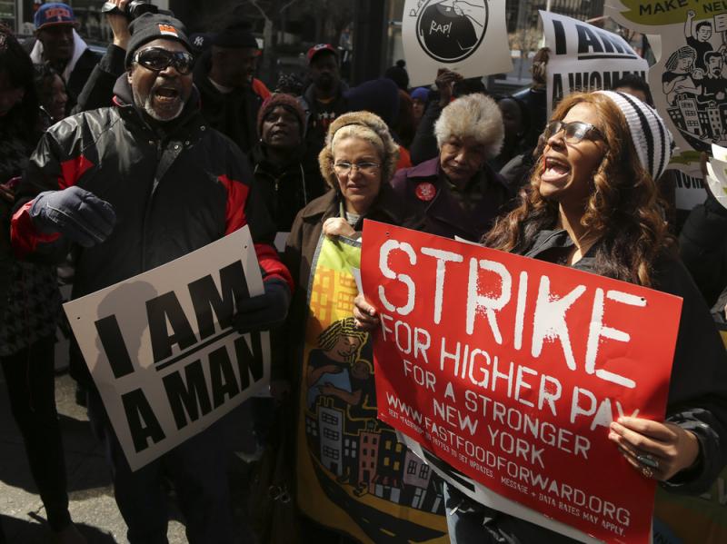 Demonstrators from the Fast Food Forward rally protest Thursday outside a Wendy's restaurant in New York City. Demonstrators from the Fast Food Forward rally protest Thursday outside a Wendy's restaurant in New York City.