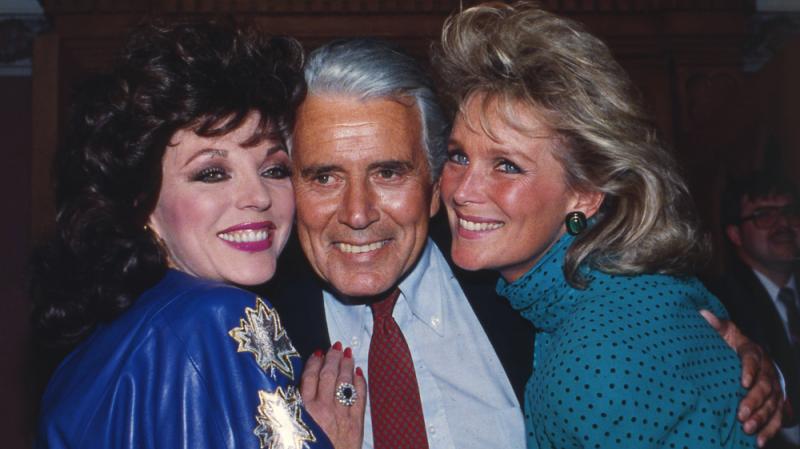 Joan Collins, John Forsythe and Linda Evans at a party celebrating the production of 150 episodes of Dynasty in 1986. Joan Collins, John Forsythe and Linda Evans at a party celebrating the production of 150 episodes of Dynasty in 1986.