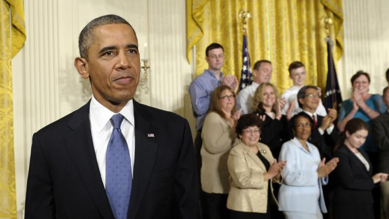 President Obama walks off the stage after speaking about the Affordable Care Act during an event in the East Room of the White House on Thursday. Obama argued that the law is holding insurance companies accountable and putting money back into the pockets President Obama walks off the stage after speaking about the Affordable Care Act during an event in the East Room of the White House on Thursday. Obama argued that the law is holding insurance companies accountable and putting money back into the pockets