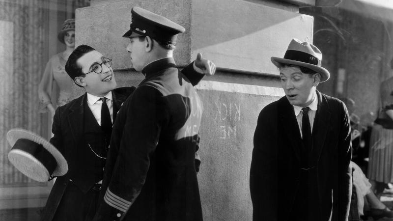 Harold Lloyd (left) is the All-American Boy, a striver who'll brave nearly anything to get to the top and win The Girl. Noah Young is The Law (center) and Bill Strother is The Pal. Harold Lloyd (left) is the All-American Boy, a striver who'll brave nearly anything to get to the top and win The Girl. Noah Young is The Law (center) and Bill Strother is The Pal.