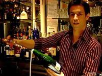 Brice from the Bubble Lounge in New York City demonstrates how to saber a bottle of champagne. Brice from the Bubble Lounge in New York City demonstrates how to saber a bottle of champagne.