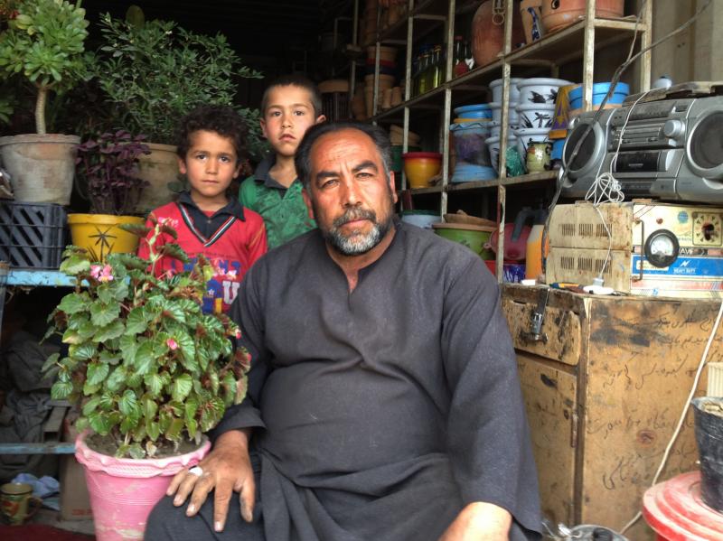 Saifulzul Husseini (right) works in Dashti Barchi, a Hazara neighborhood of Kabul. He believes that ethnicity should be listed on the new identity card. Saifulzul Husseini (right) works in Dashti Barchi, a Hazara neighborhood of Kabul. He believes that ethnicity should be listed on the new identity card.