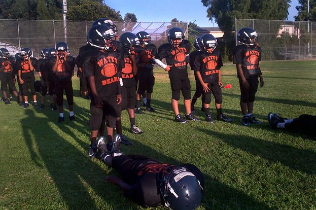 The Los Angeles Police Department helped launch the Watts Bears, a team of the Pee Wee division of Pop Warner football, in 2012. The players come from the neighborhood and practice at a park that's considered a neutral site between local gangs. The Los Angeles Police Department helped launch the Watts Bears, a team of the Pee Wee division of Pop Warner football, in 2012. The players come from the neighborhood and practice at a park that's considered a neutral site between local gangs.