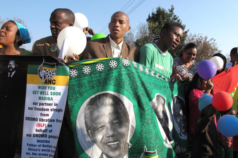 Supporters of Nelson Mandela rally outside the Mediclinic Heart Hospital in Pretoria, South Africa, where he has been treated for more than a month. The anti-apartheid icon turned 95 on Thursday. Supporters of Nelson Mandela rally outside the Mediclinic Heart Hospital in Pretoria, South Africa, where he has been treated for more than a month. The anti-apartheid icon turned 95 on Thursday.