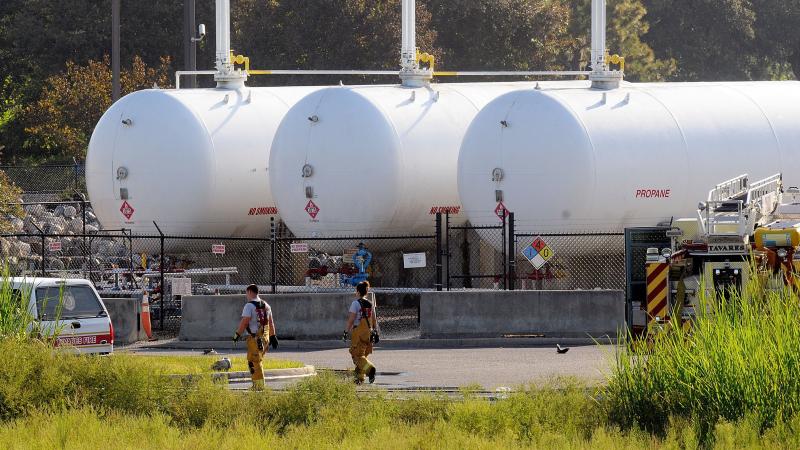 Propane cylinders sit on the grounds of Blue Rhino, a propane gas company, in Tavares, Fla. In the Midwest, farmers needed more propane for crops that came in later than normal. Propane cylinders sit on the grounds of Blue Rhino, a propane gas company, in Tavares, Fla. In the Midwest, farmers needed more propane for crops that came in later than normal.