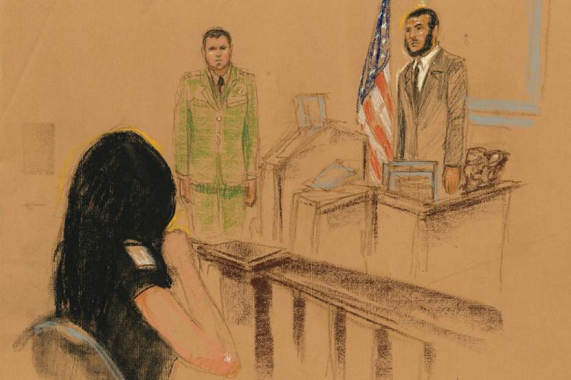 Omar Khadr apologizes to Tabitha Speer, who shakes her head "no" and weeps. Omar Khadr apologizes to Tabitha Speer, who shakes her head "no" and weeps.
