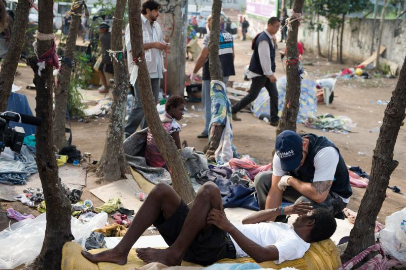 A member of Rio de Janeiro's Social Work Department speaks with crack addicts in a slum area known as "Crackland," during a police operation in the city in November. A member of Rio de Janeiro's Social Work Department speaks with crack addicts in a slum area known as "Crackland," during a police operation in the city in November.