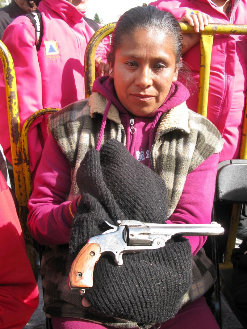 In Mexico City, Sara Martinez Franco holds a .38-caliber revolver that belonged to her grandfather. She traded in the weapon — which she says was used during the Mexican Revolution — under the buyback program. In Mexico City, Sara Martinez Franco holds a .38-caliber revolver that belonged to her grandfather. She traded in the weapon — which she says was used during the Mexican Revolution — under the buyback program.