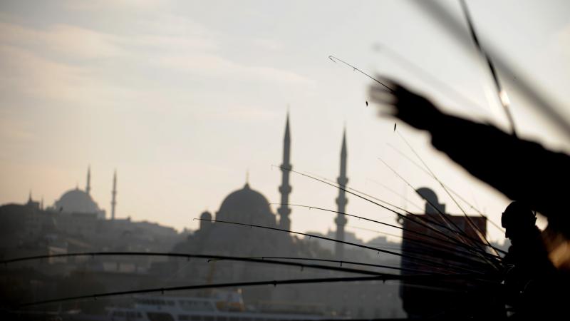 Anglers fish off Galata Bridge in Istanbul in 2011. The bridge is within site of the modest waterside restaurant Akin Balik. Anglers fish off Galata Bridge in Istanbul in 2011. The bridge is within site of the modest waterside restaurant Akin Balik.
