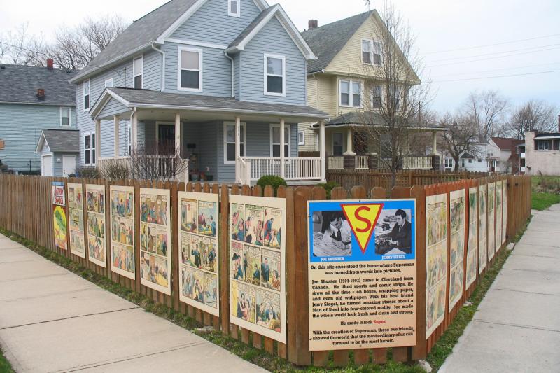 Panels from Action Comics No. 1, the first Superman comic, adorn the site of illustrator Joe Shuster's former apartment building, long since demolished. Panels from Action Comics No. 1, the first Superman comic, adorn the site of illustrator Joe Shuster's former apartment building, long since demolished.