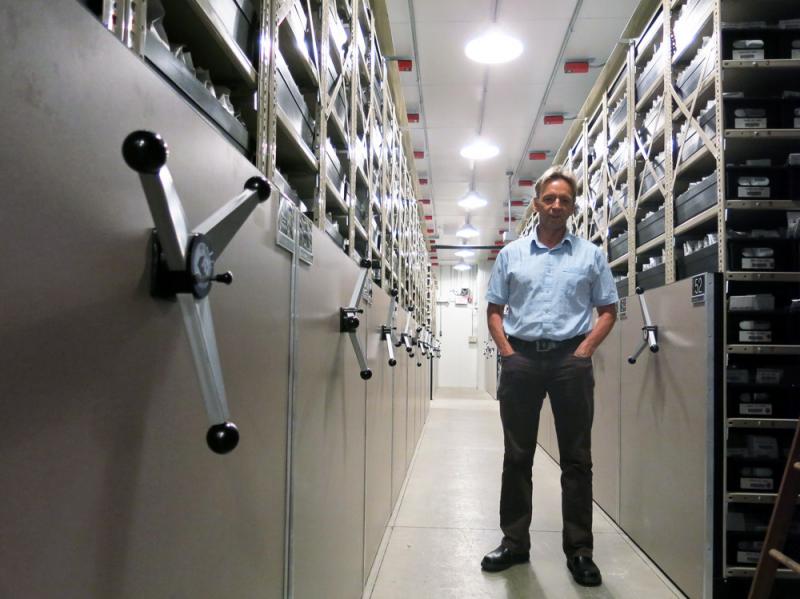 Dave Dierig, research leader at the National Center for Genetic Resources Preservation, stands among the ceiling-high shelves that hold the 600,000 seed packets in this cold storage vault. Dave Dierig, research leader at the National Center for Genetic Resources Preservation, stands among the ceiling-high shelves that hold the 600,000 seed packets in this cold storage vault.