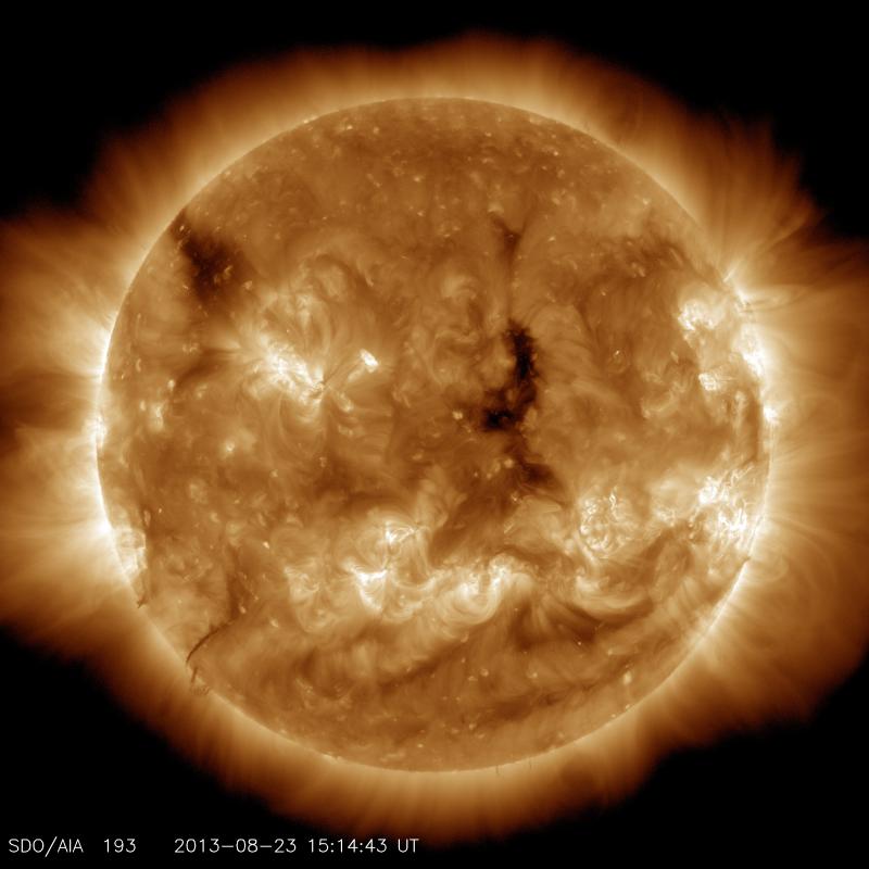 This image highlights the outer atmosphere of the sun, called the corona, as well as hot flare plasma. Hot active regions, solar flares and coronal mass ejections appear bright here. The dark areas, called coronal holes, are places where very little radia This image highlights the outer atmosphere of the sun, called the corona, as well as hot flare plasma. Hot active regions, solar flares and coronal mass ejections appear bright here. The dark areas, called coronal holes, are places where very little radia