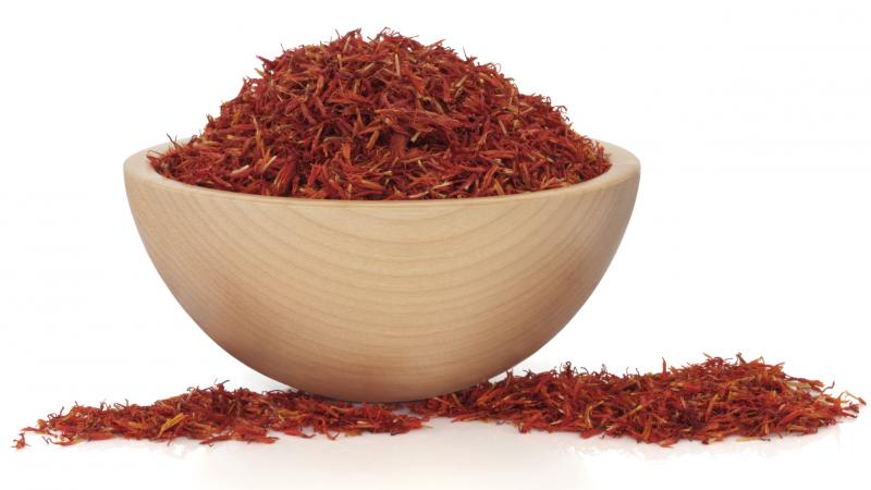 Saffron is a stringy red spice made from the dried stigma of a saffron flower. Saffron is a stringy red spice made from the dried stigma of a saffron flower.